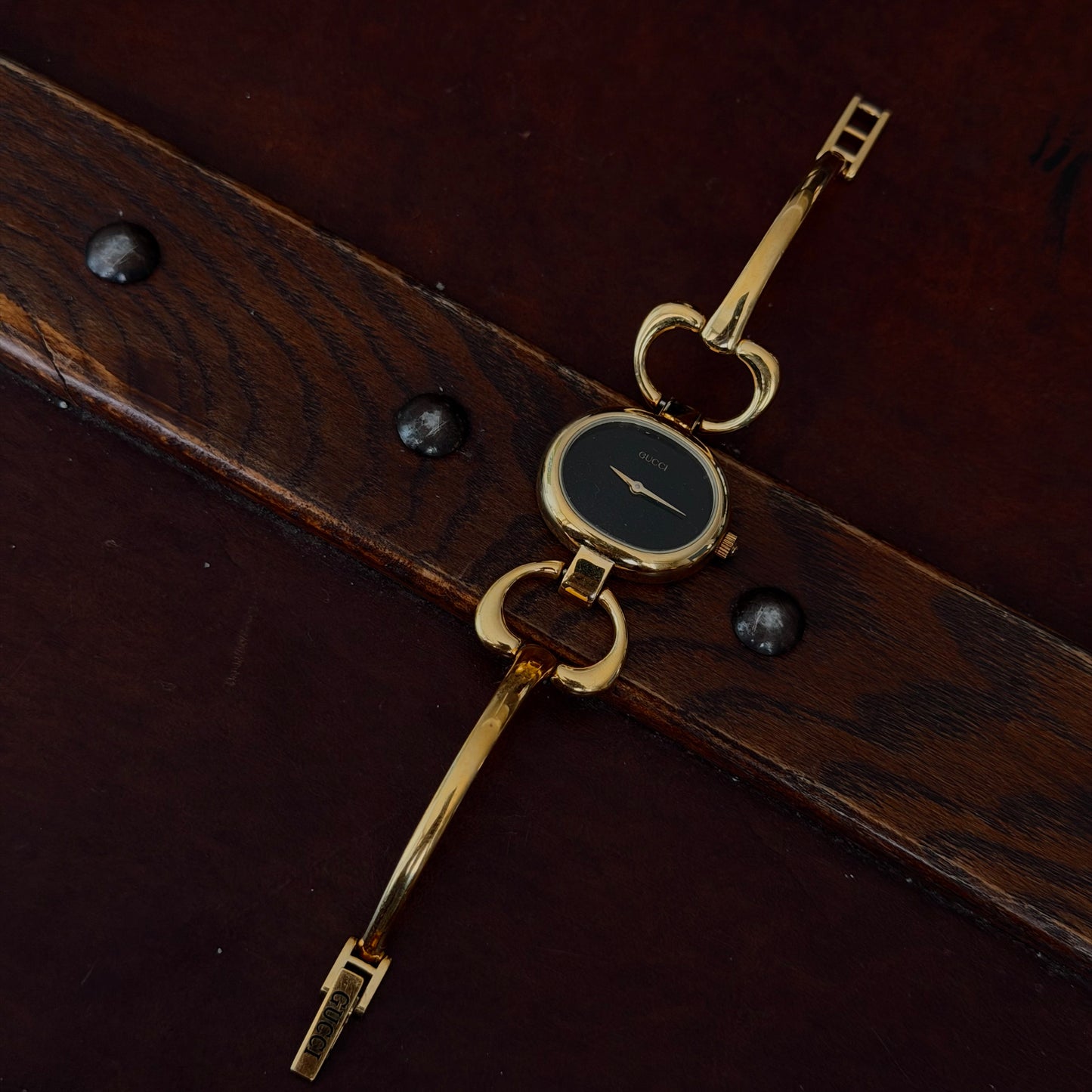 Gucci Gold Black Dial Horsebit Bangle Watch