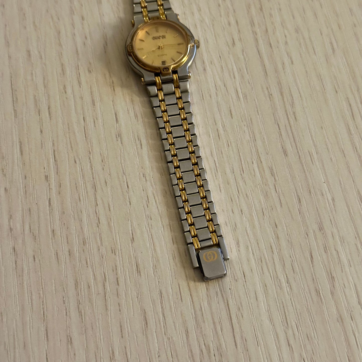 Gucci 26mm Dainty Two-Tone Gold Dial Date Watch