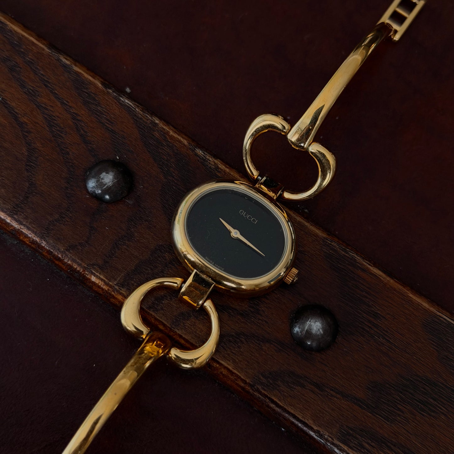Gucci Gold Black Dial Horsebit Bangle Watch